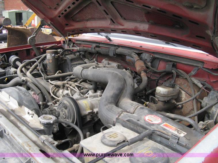 image for item 8012 1991 Ford F350 Custom XLT Lariat four-door flatbed dually pickup