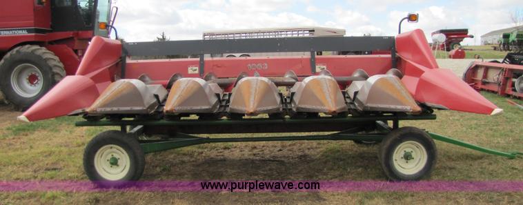 image for item 8725 1995 Case 1063 six row corn head and header trailer