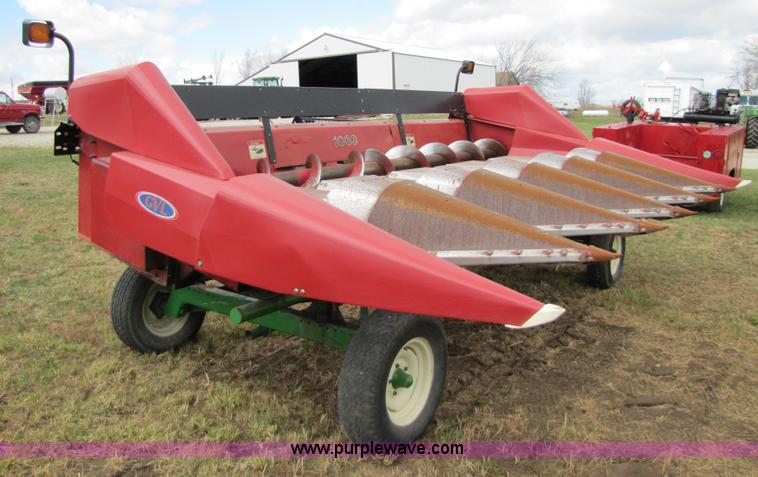 image for item 8725 1995 Case 1063 six row corn head and header trailer