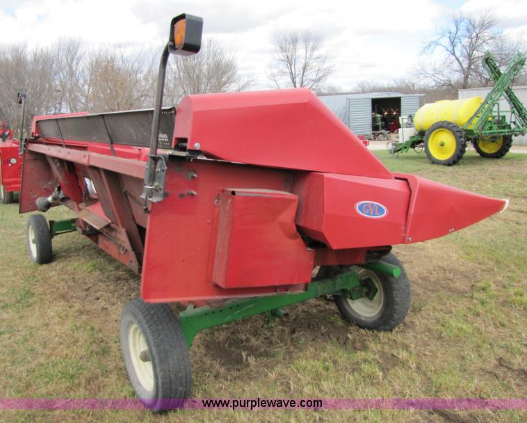 image for item 8725 1995 Case 1063 six row corn head and header trailer