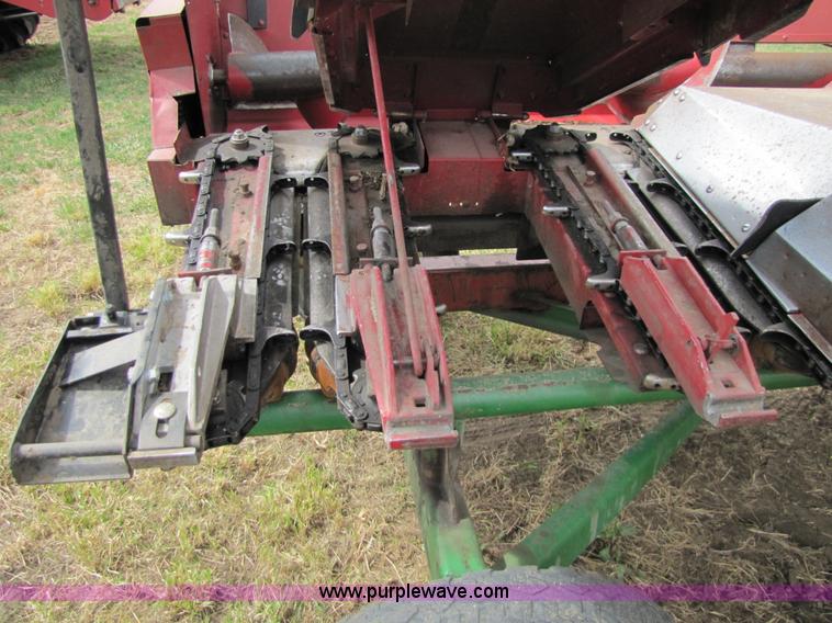 image for item 8725 1995 Case 1063 six row corn head and header trailer