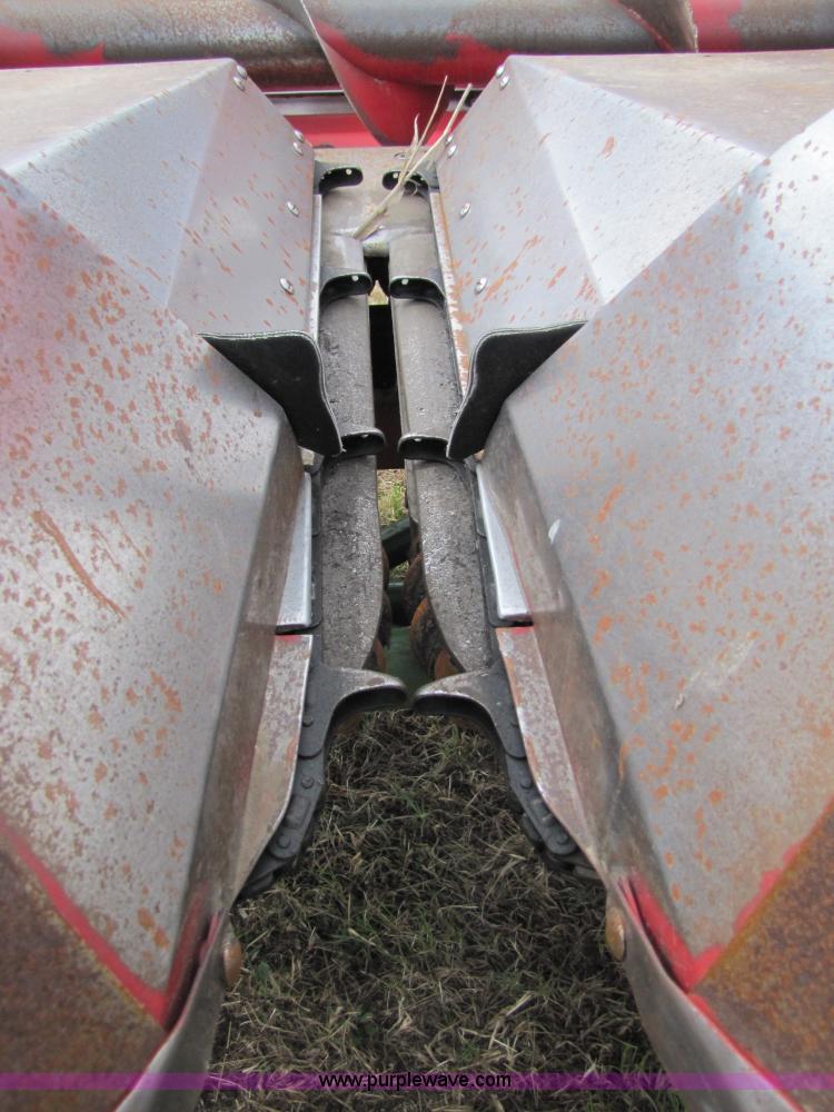 image for item 8725 1995 Case 1063 six row corn head and header trailer