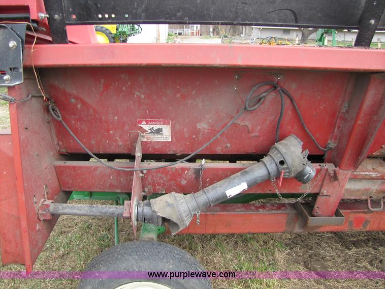 image for item 8725 1995 Case 1063 six row corn head and header trailer