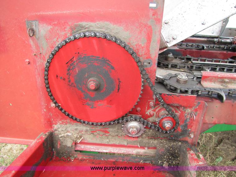 image for item 8725 1995 Case 1063 six row corn head and header trailer