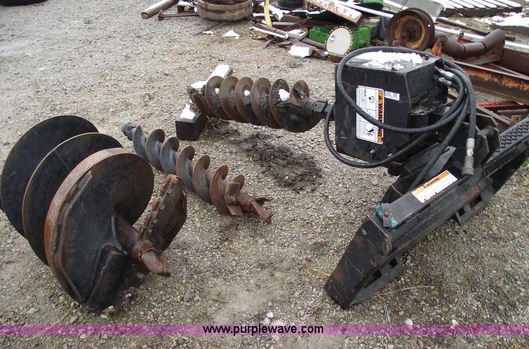 image for item 5509 Lowe skid steer auger with three bits