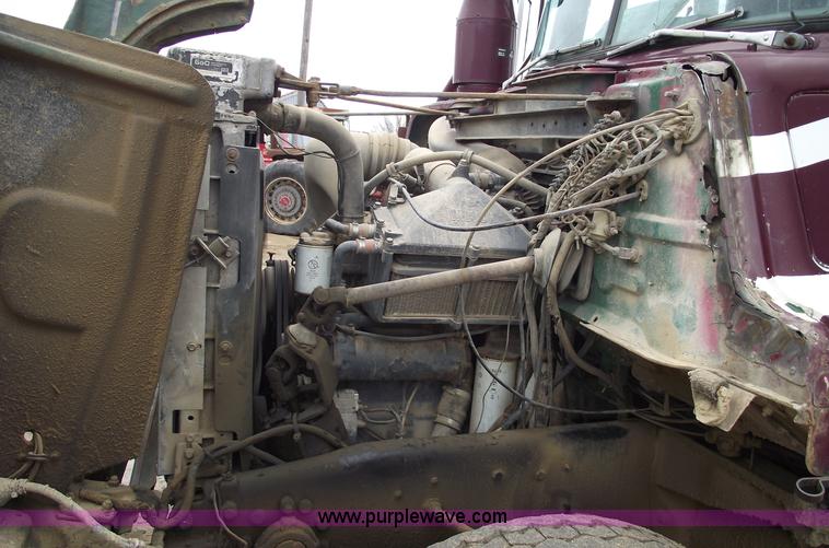 image for item 5761 1987 Mack DM686S roll-off truck