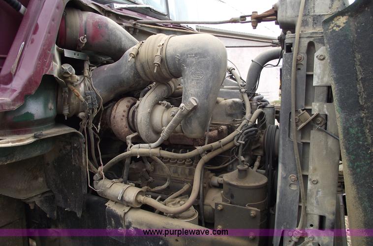 image for item 5761 1987 Mack DM686S roll-off truck