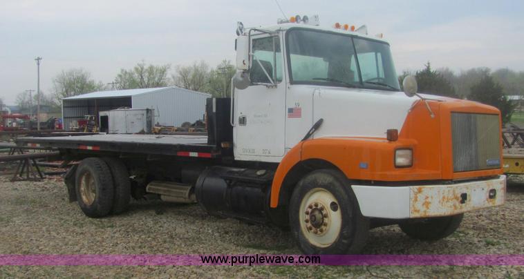 image for item 6174 1990 GM Volvo WG Rollback truck