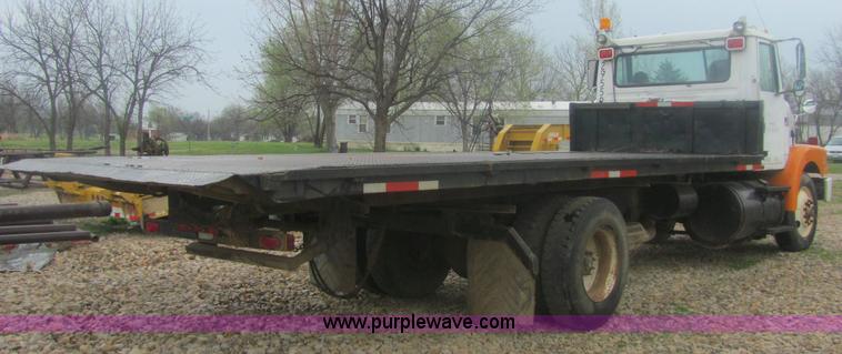 image for item 6174 1990 GM Volvo WG Rollback truck