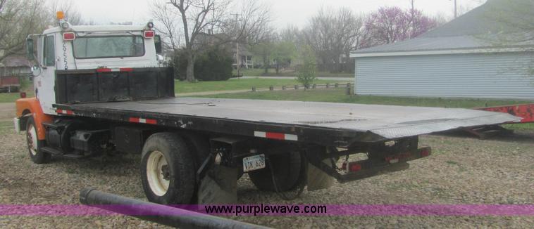 image for item 6174 1990 GM Volvo WG Rollback truck