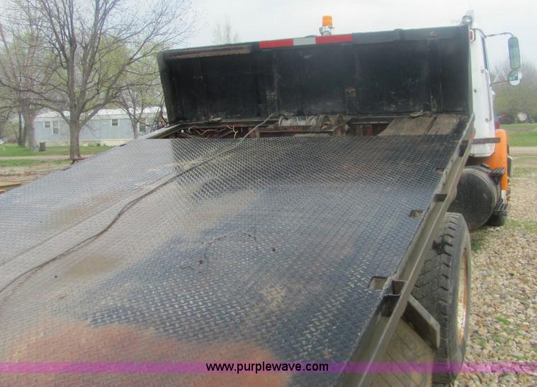 image for item 6174 1990 GM Volvo WG Rollback truck