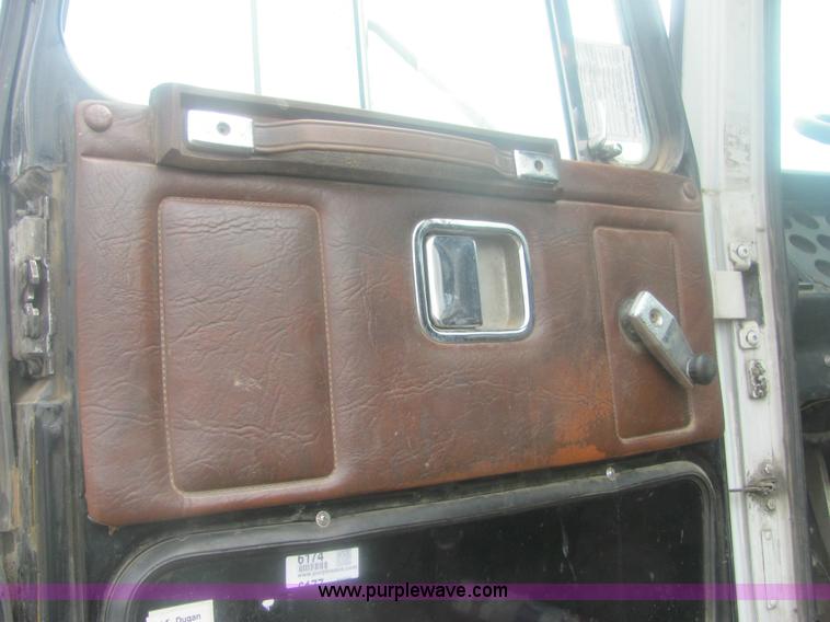 image for item 6174 1990 GM Volvo WG Rollback truck