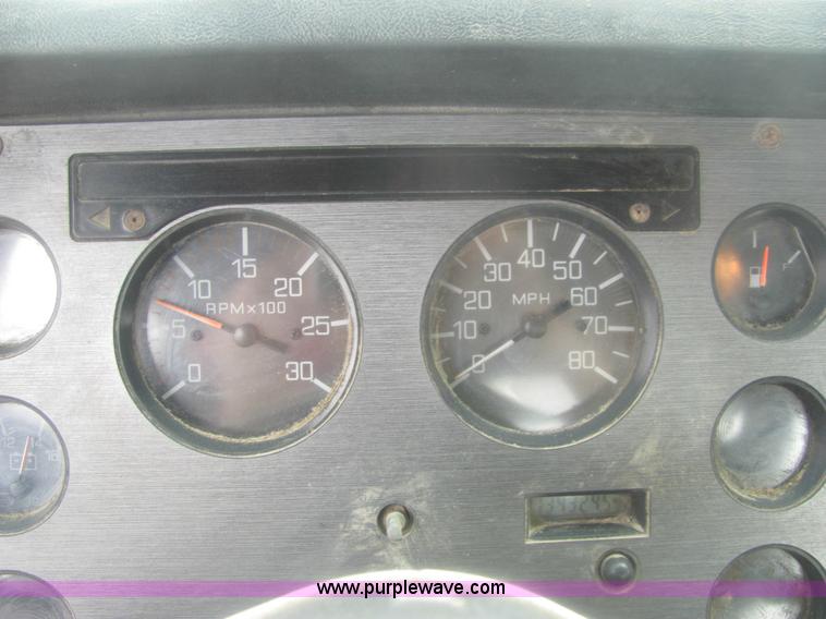 image for item 6174 1990 GM Volvo WG Rollback truck