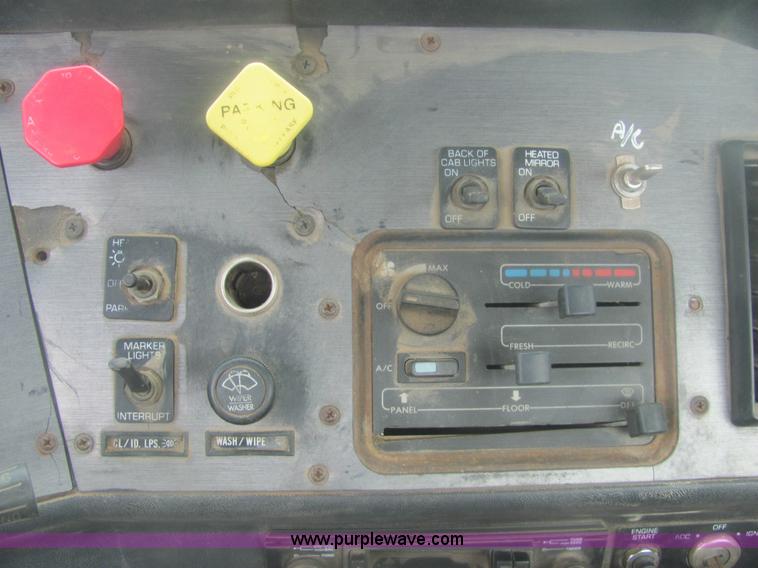 image for item 6174 1990 GM Volvo WG Rollback truck