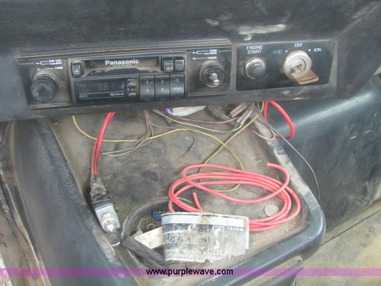 image for item 6174 1990 GM Volvo WG Rollback truck