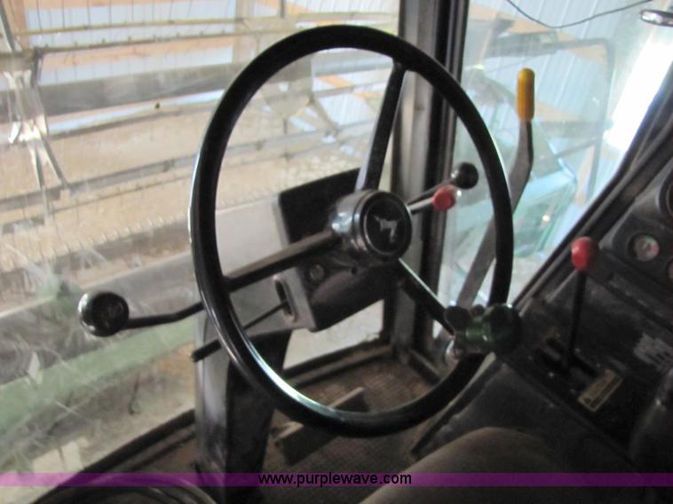 image for item 8660 1979 John Deere 7720 combine and header