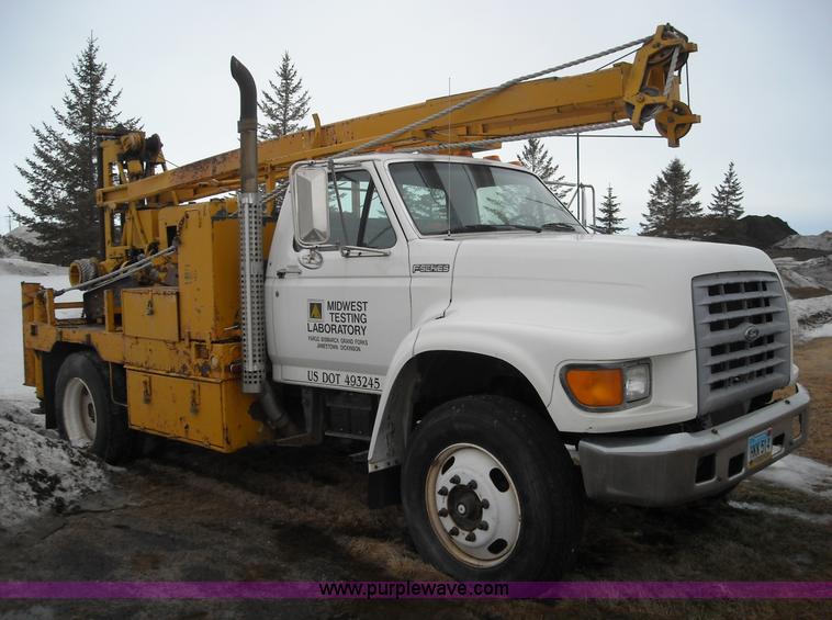 image for item 1001 1998 Ford F800 truck with CME drill attachment