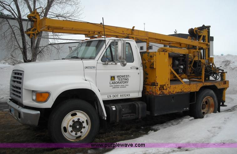 image for item 1001 1998 Ford F800 truck with CME drill attachment