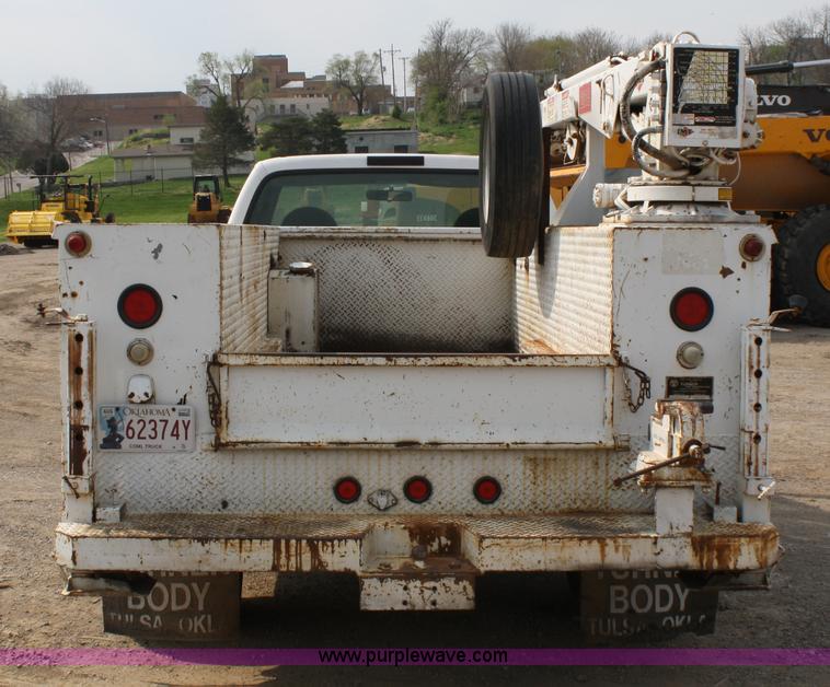 image for item 4909 1999 Ford F450 Super Duty pickup truck with service bed