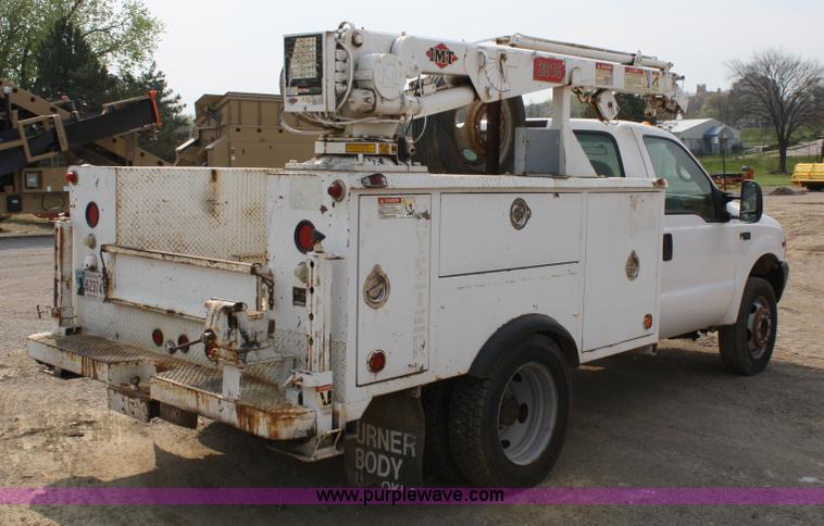 image for item 4909 1999 Ford F450 Super Duty pickup truck with service bed