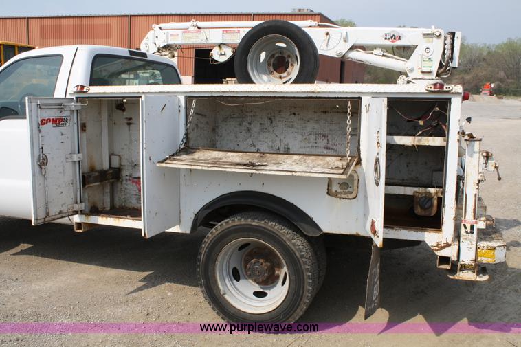 image for item 4909 1999 Ford F450 Super Duty pickup truck with service bed