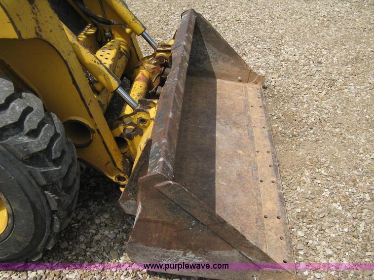 image for item 8136 John Deere 250 skid loader