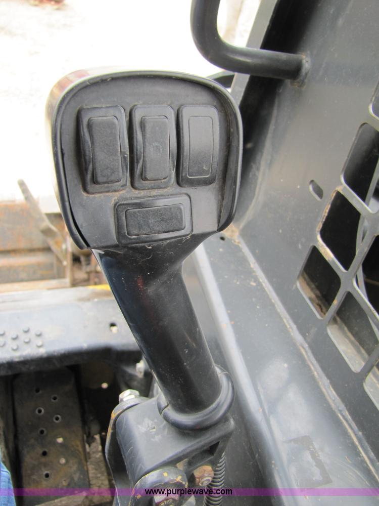 image for item 8671 New Holland LS180 skid steer