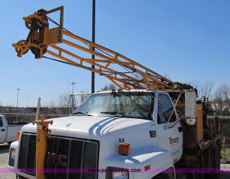 image for item 8990 1998 GMC C7500 truck with CME drilling attachment