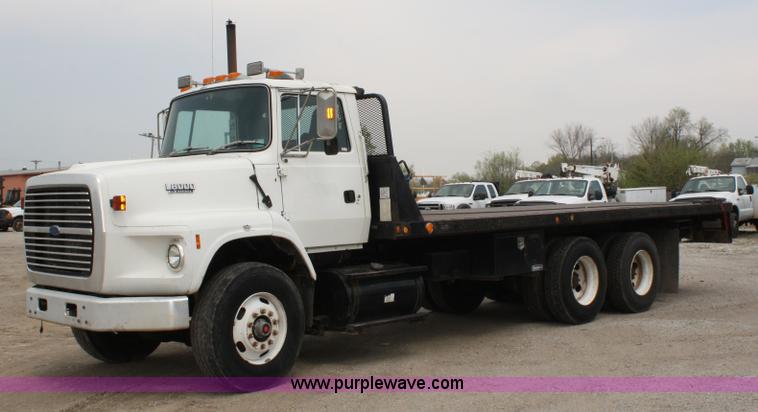 image for item 4908 1994 Ford LTS8000 Rollback semi truck