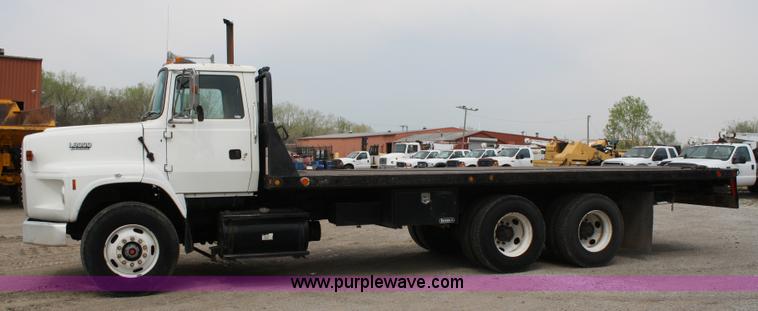 image for item 4908 1994 Ford LTS8000 Rollback semi truck