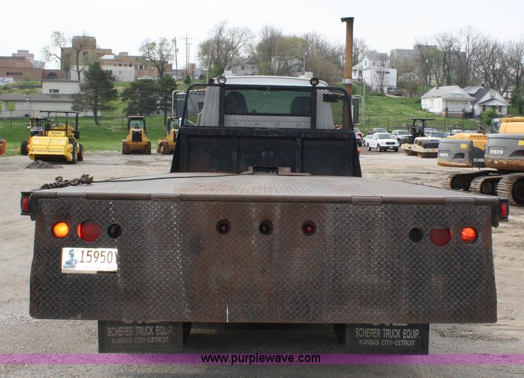 image for item 4908 1994 Ford LTS8000 Rollback semi truck