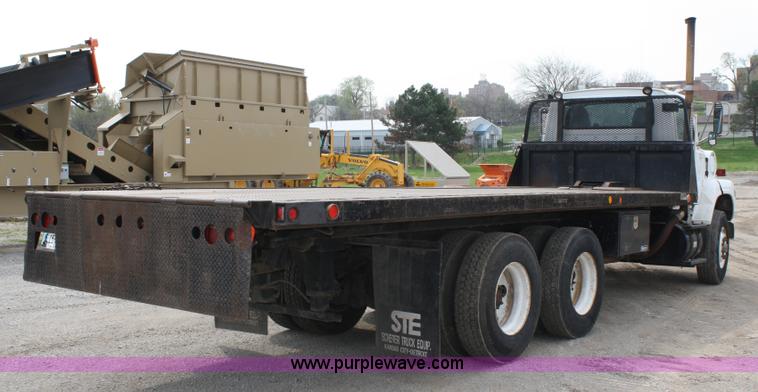 image for item 4908 1994 Ford LTS8000 Rollback semi truck