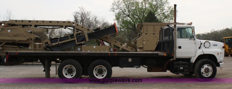 image for item 4908 1994 Ford LTS8000 Rollback semi truck