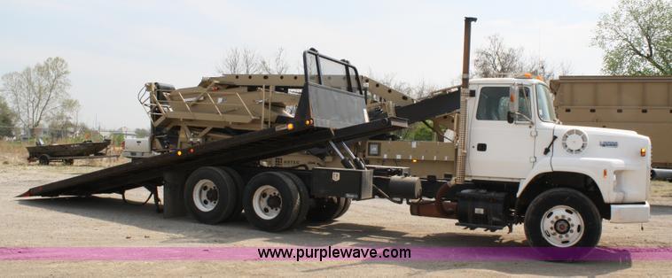 image for item 4908 1994 Ford LTS8000 Rollback semi truck