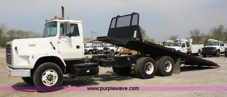 image for item 4908 1994 Ford LTS8000 Rollback semi truck