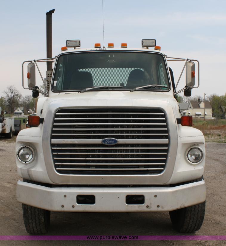 image for item 4908 1994 Ford LTS8000 Rollback semi truck