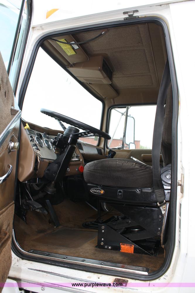 image for item 4908 1994 Ford LTS8000 Rollback semi truck