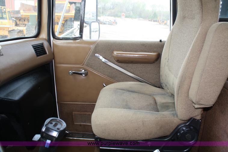 image for item 4908 1994 Ford LTS8000 Rollback semi truck