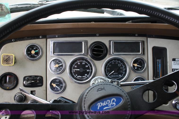 image for item 4908 1994 Ford LTS8000 Rollback semi truck