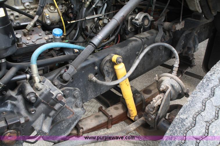 image for item 4908 1994 Ford LTS8000 Rollback semi truck