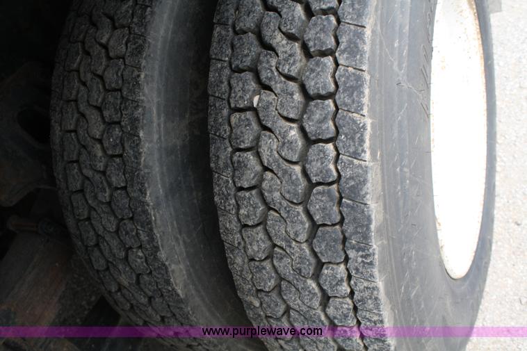 image for item 4908 1994 Ford LTS8000 Rollback semi truck