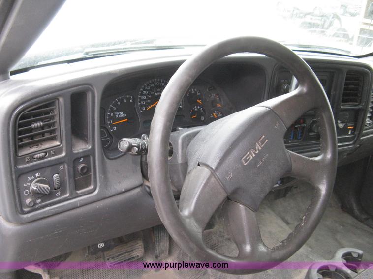 image for item 8134 2004 GMC Sierra 1500 long bed pickup truck with topper