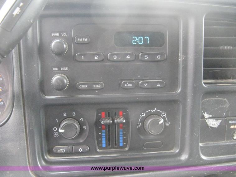 image for item 8134 2004 GMC Sierra 1500 long bed pickup truck with topper