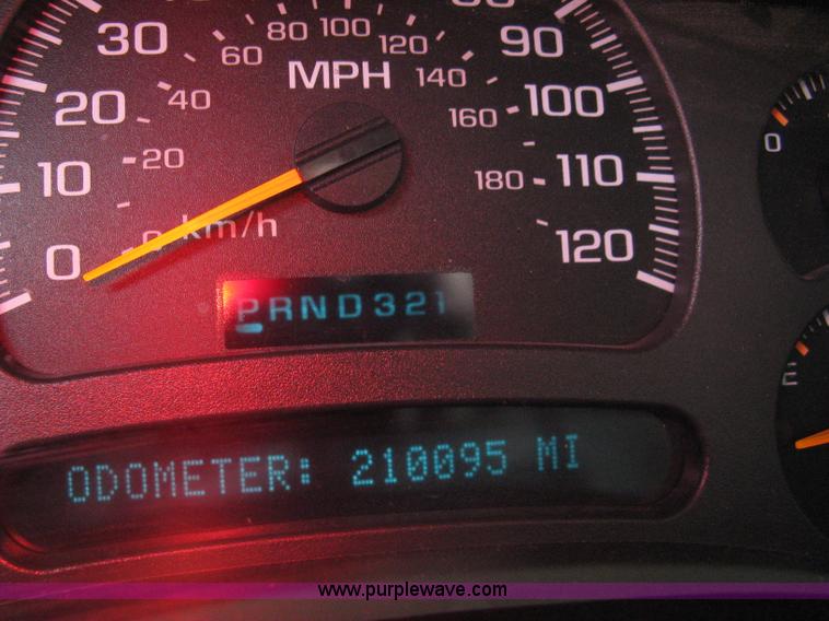 image for item 8134 2004 GMC Sierra 1500 long bed pickup truck with topper