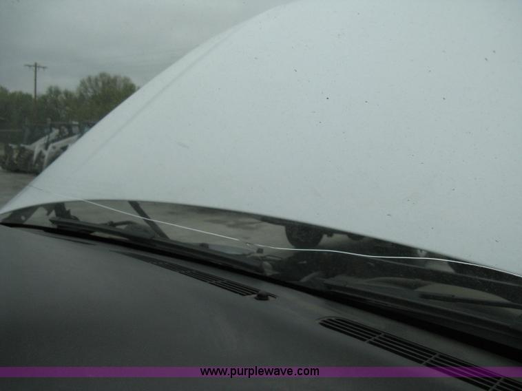 image for item 8134 2004 GMC Sierra 1500 long bed pickup truck with topper