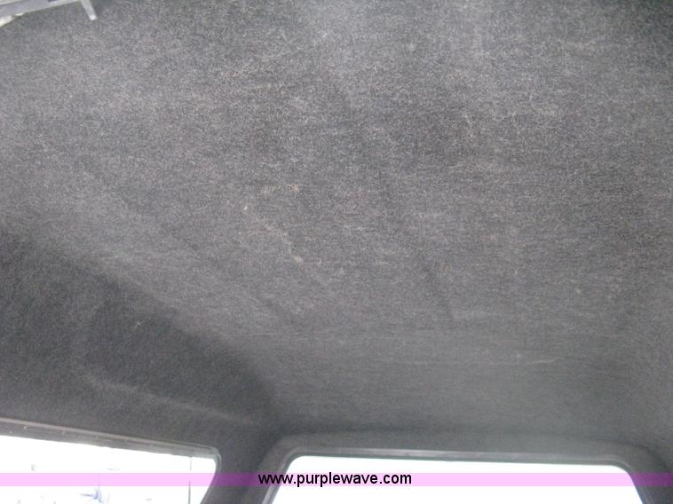 image for item 8134 2004 GMC Sierra 1500 long bed pickup truck with topper