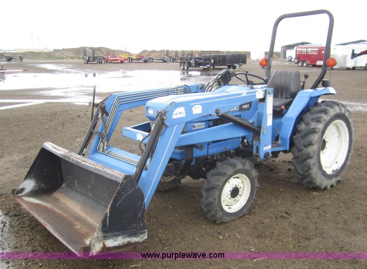 image for item 2990 2004 New Holland TC30 MFWD tractor with loader