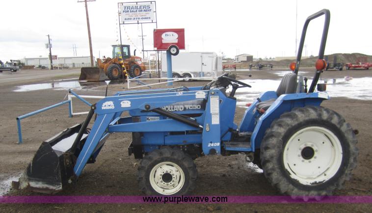 image for item 2990 2004 New Holland TC30 MFWD tractor with loader