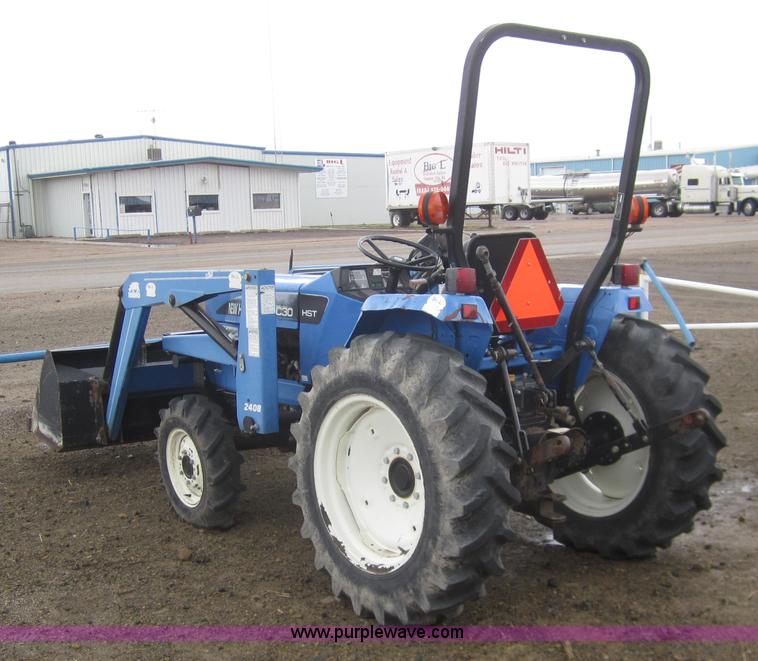 image for item 2990 2004 New Holland TC30 MFWD tractor with loader