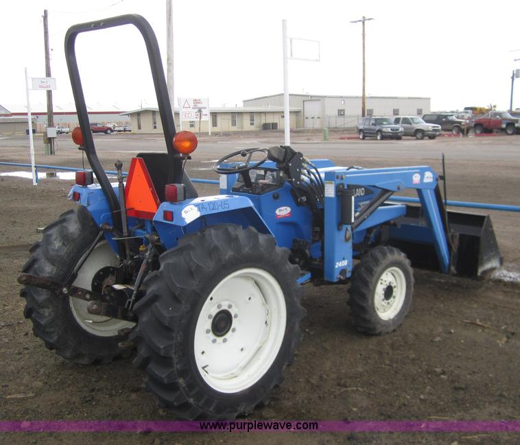 image for item 2990 2004 New Holland TC30 MFWD tractor with loader